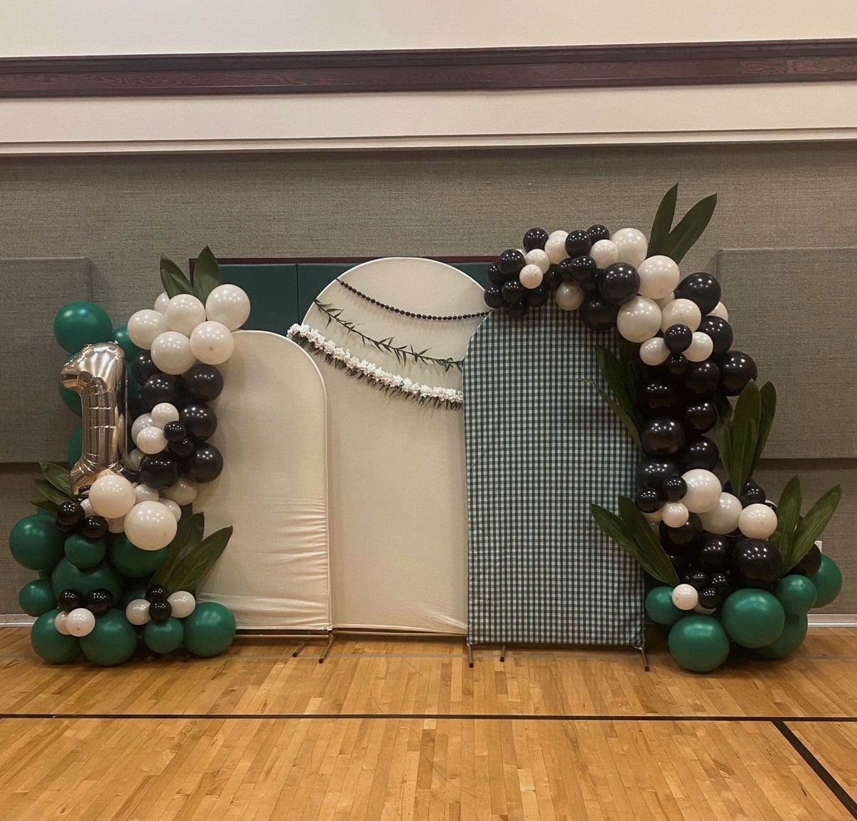 Pearl-inspired backdrop and balloon garlands