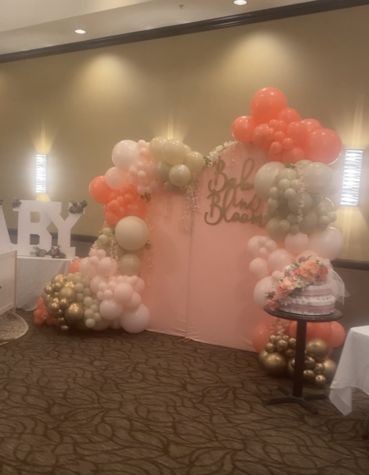 Pink celebration backdrop and balloon styling