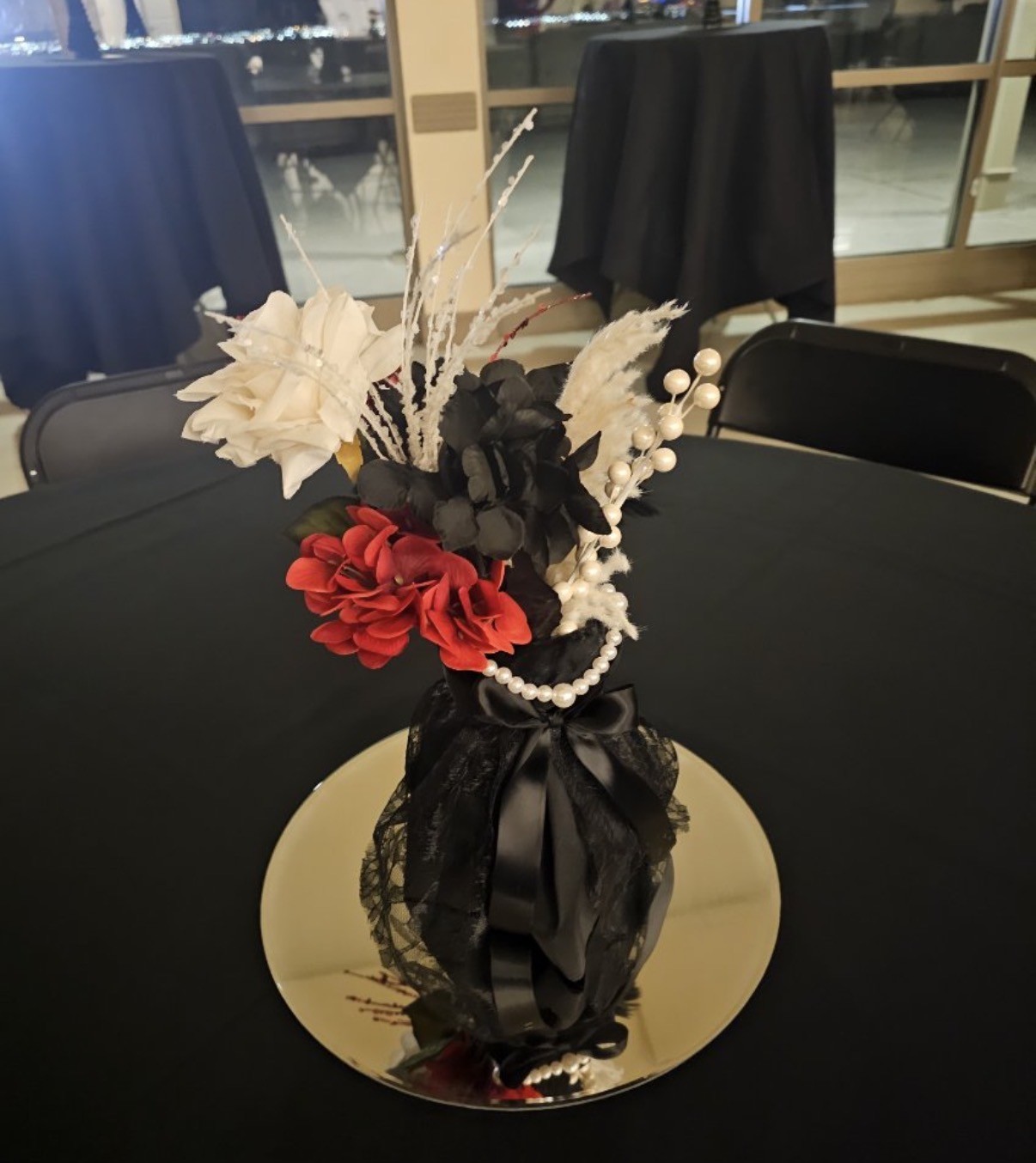 Red rose and feather centerpiece
